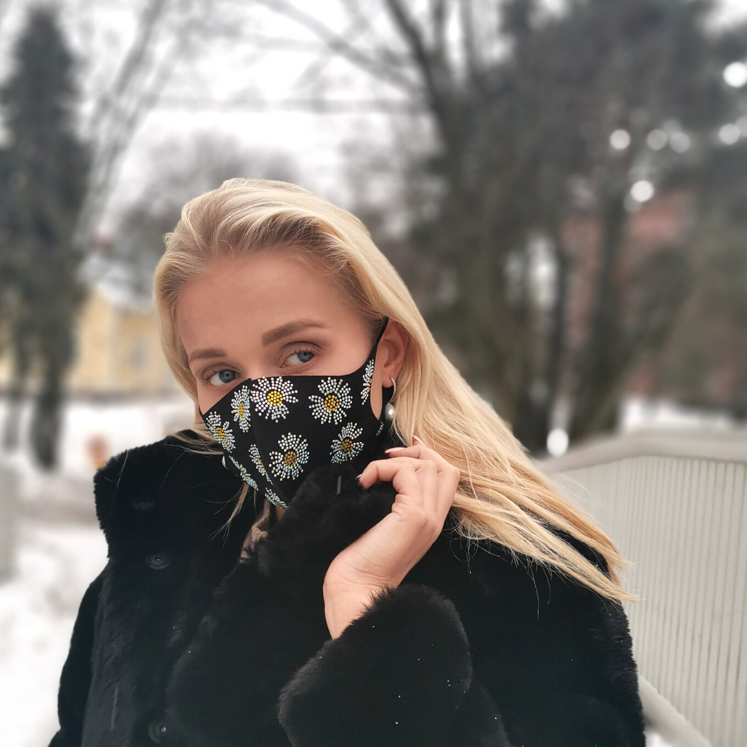 Face mask with floral decorations